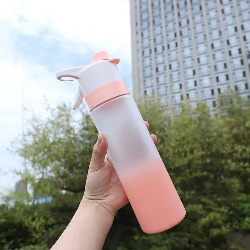 Translucent decorbites girls 700ml spray water bottle with pink to white ombre finish and white spray nozzle for sports