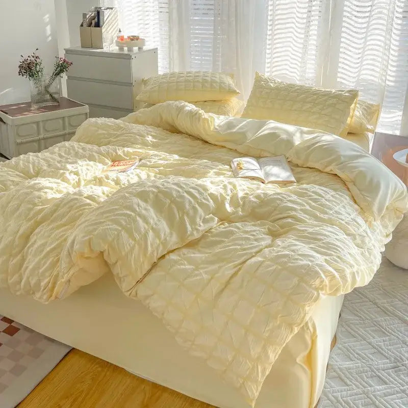 Cream-colored quilted decorbites girls bubble gauze bedding set with soft textured surface and matching pillows for summer comfort