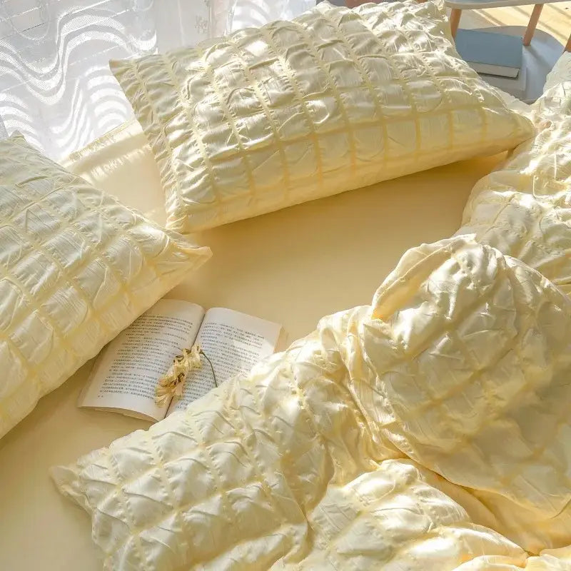 Cream-colored quilted satin pillowcases with subtle sheen and soft texture from decorbites girls bubble gauze bedding set