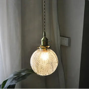 DecorBites Glabe glass LED pendant light fixture with warm textured glass and brass hardware for bedroom and kitchen