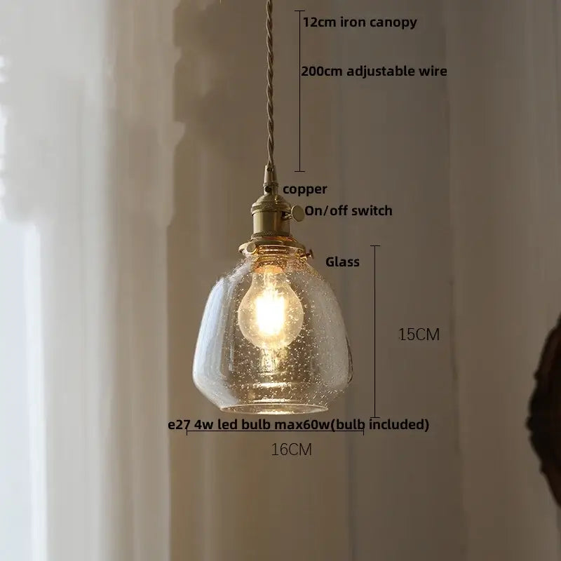 A warm-toned glass pendant lamp with textured crackled finish and brass fittings from DecorBites Glabe LED pendant