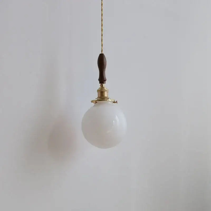 Vintage-style decorbites glabe led pendant lamp with frosted white glass globe brass hardware and dark walnut wood handle