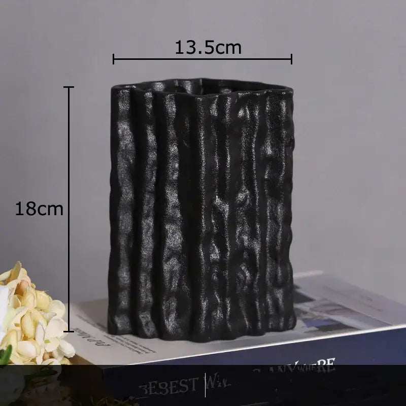 Black ceramic vase with vertical ribbed texture and matte finish from decorbites glacial ceramic vase collection