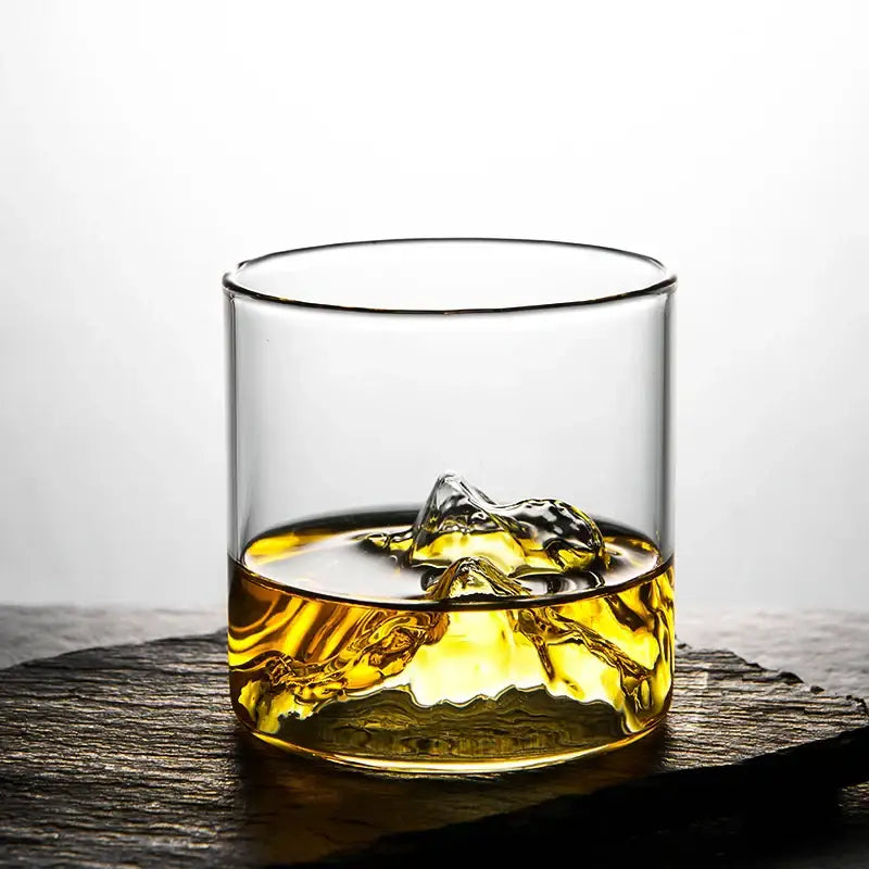 Clear glass decorbites glacier wine cup filled with amber whiskey and ice showcasing Japanese style design