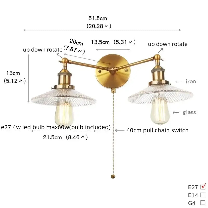 Brass-finished wall sconce with dual clear glass shades and pull chain switch for bedroom and bathroom lighting