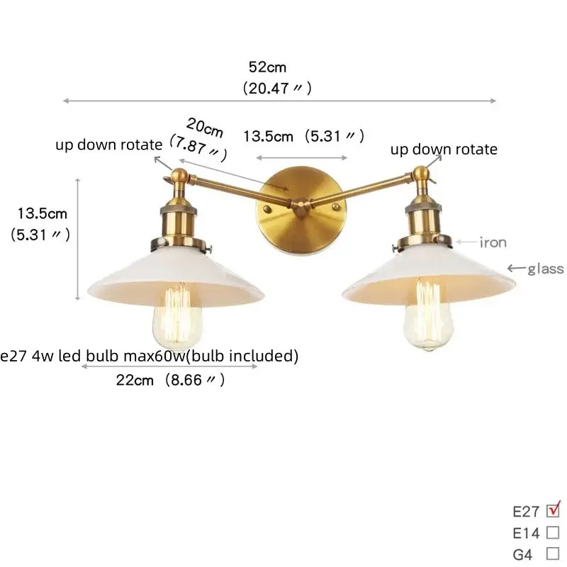 Brass-finished wall sconce with two adjustable arms and frosted glass shades featuring exposed edison bulbs and pull chain switch
