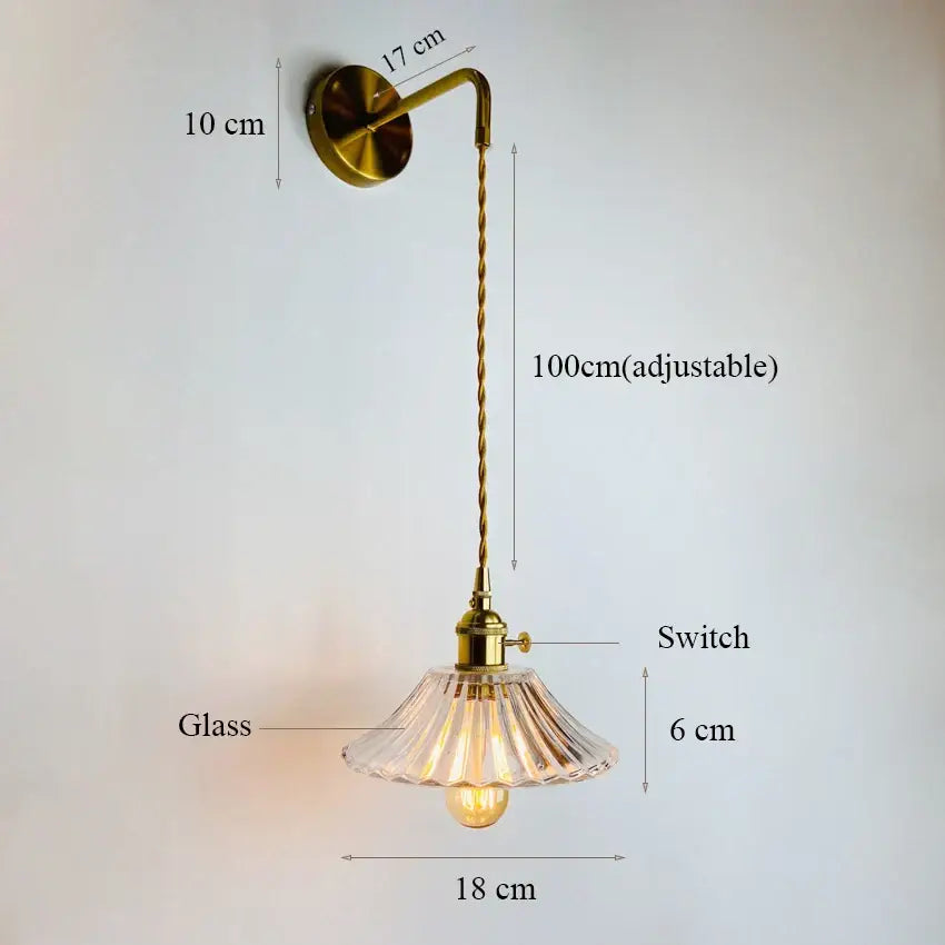 Brass-finished decorbites glass adjustable wall light with clear fluted glass shade and 100cm twisted cord for bedroom use