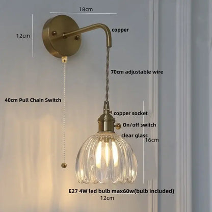 Antique brass-finished decorbites glass adjustable wall lamp with faceted clear glass shade and copper socket