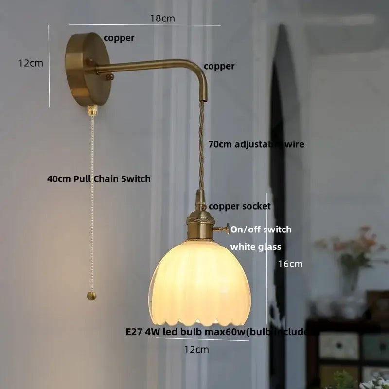 Antique brass-finished DecorBites glass adjustable wall lamp with scalloped white glass shade and copper wire arm