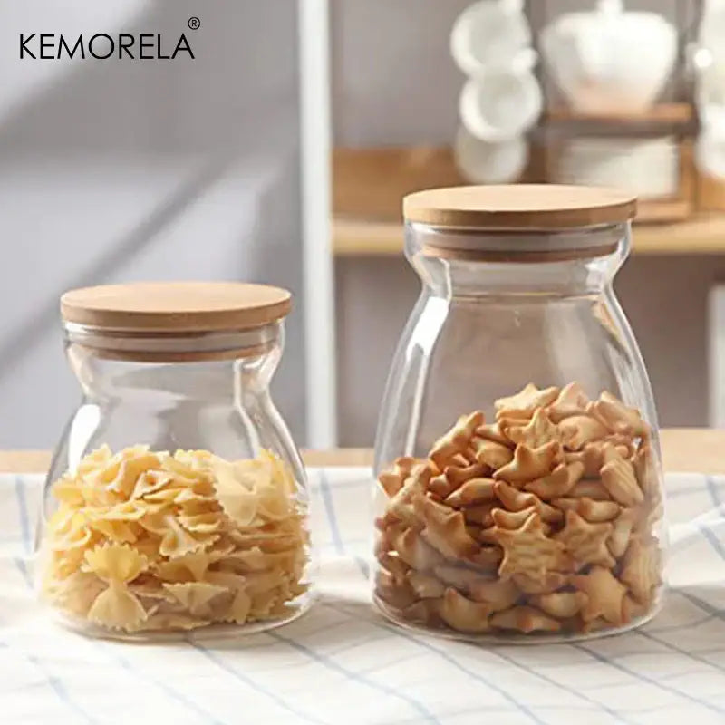 Decorbites glass airtight canister with natural wood lid storing bow-tie pasta and star-shaped cookies for kitchen use