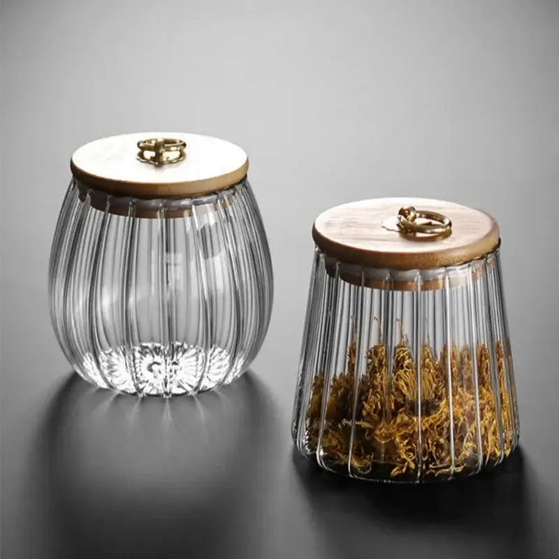 Clear decorbites glass airtight canister with vertical ridges and wooden lid featuring brass ring handle for kitchen storage