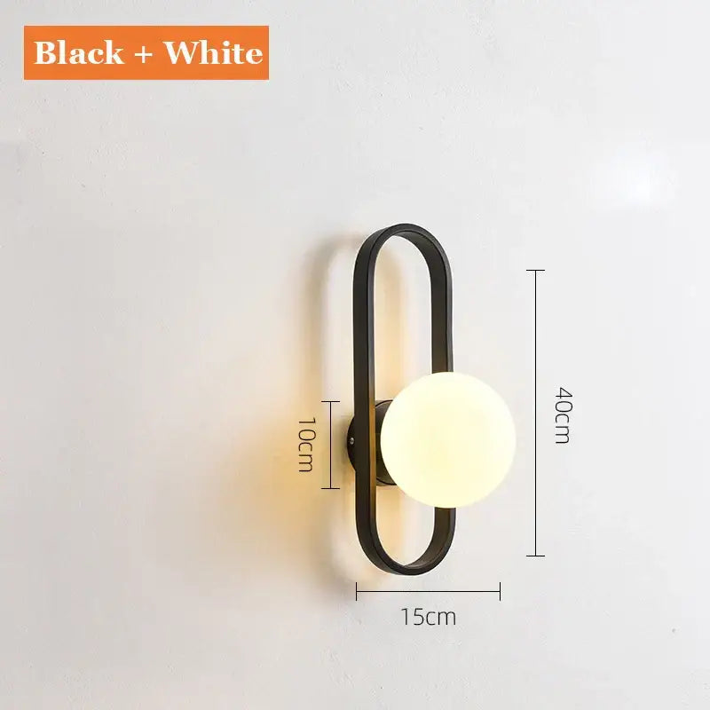 Black and white DecorBites glass aisle wall lamp with minimalist frame and round frosted glass globe for indoor decor