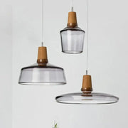 Set of three modern pendant lights with smoked glass shades and natural wood accents decorbites glass wood pendant light