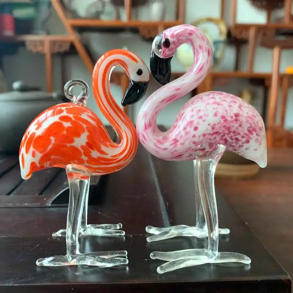 Decorbites glass animal figurines featuring hand blown glass flamingos with vibrant orange white and pink speckles