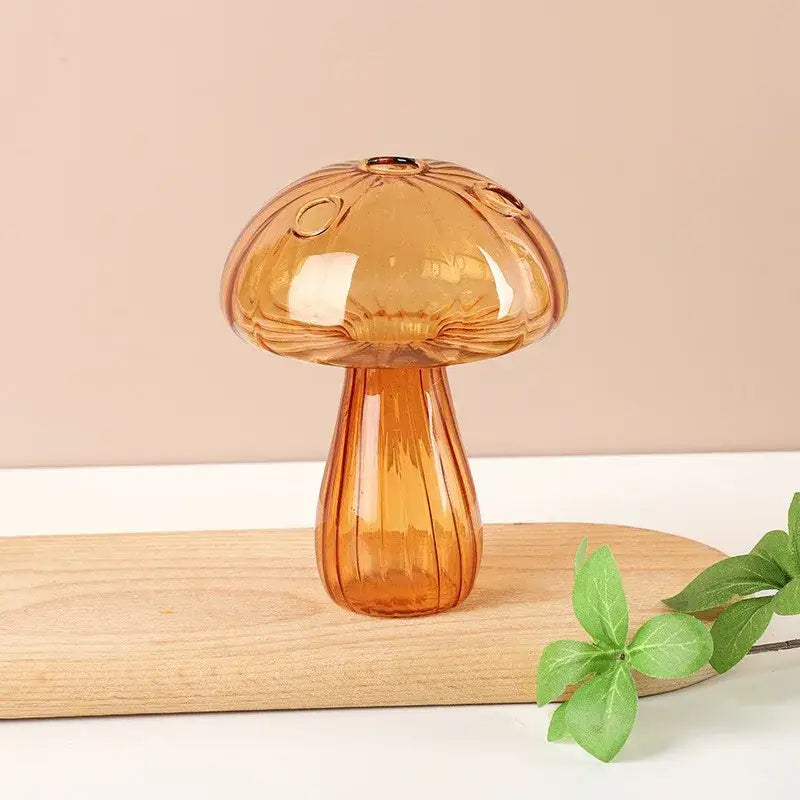 Amber-colored glass aromatherapy vase with ribbed stem and decorative cap for elegant home decor by DecorBites™