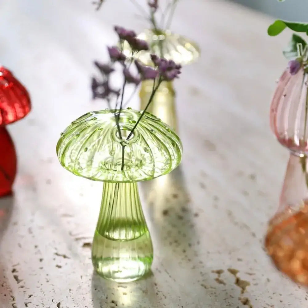 DecorBites™ translucent green glass aromatherapy vase shaped like a mushroom with purple flowers for home decor