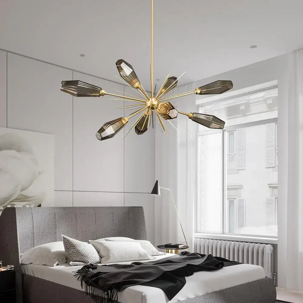 Gold-toned starburst glass art chandelier with faceted dark glass arms by DecorBites for modern living spaces