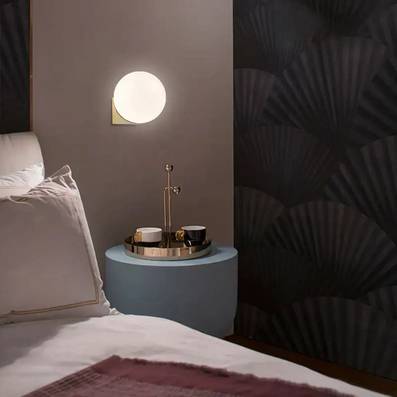 Circular decorbites glass ball art wall lamp with warm glow gold-toned metallic frame for bedroom aisle lighting
