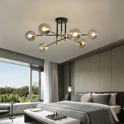 Modern black and brass decorbites glass ball chandelier with clear glass globe bulbs for nordic round dining table lighting