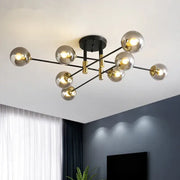 Modern decorbites glass ball black chandelier with gold accents and spherical glass globes for nordic dining rooms