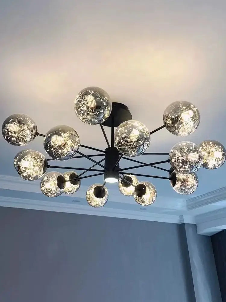 Modern black metal decorbites glass ball branch chandelier with glowing spherical glass globes for living room lighting