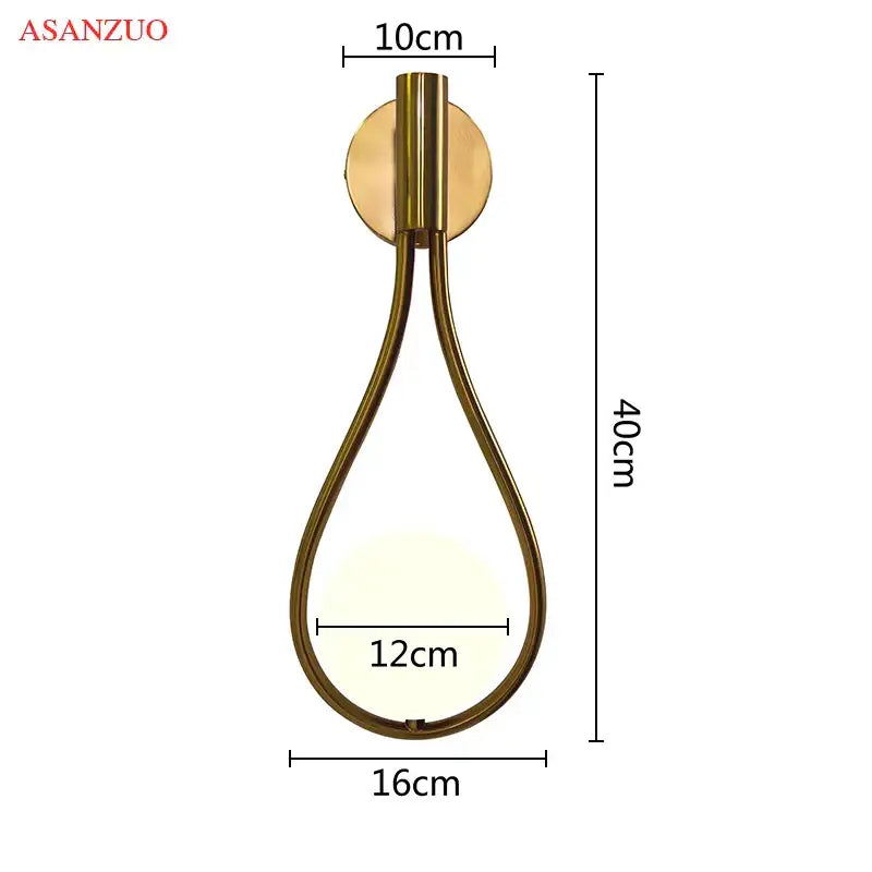 Gold-toned asanzuo wall sconce with teardrop frame and circular plate complementing decorbites glass ball brass pendant light