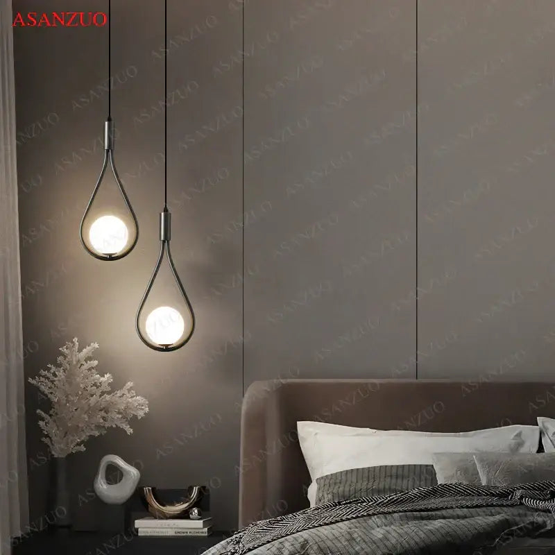Two modern black metal decorbites glass ball brass pendant lights with warm bulbs for nordic bedroom decor