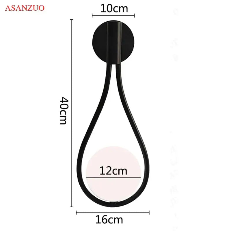 Black teardrop-shaped wall lamp with metallic finish complements decorbites glass ball brass pendant light for nordic decor