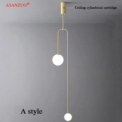 Gold-toned decorbites glass ball pendant lights with two white glass bulbs and slender metal arms for elegant lighting