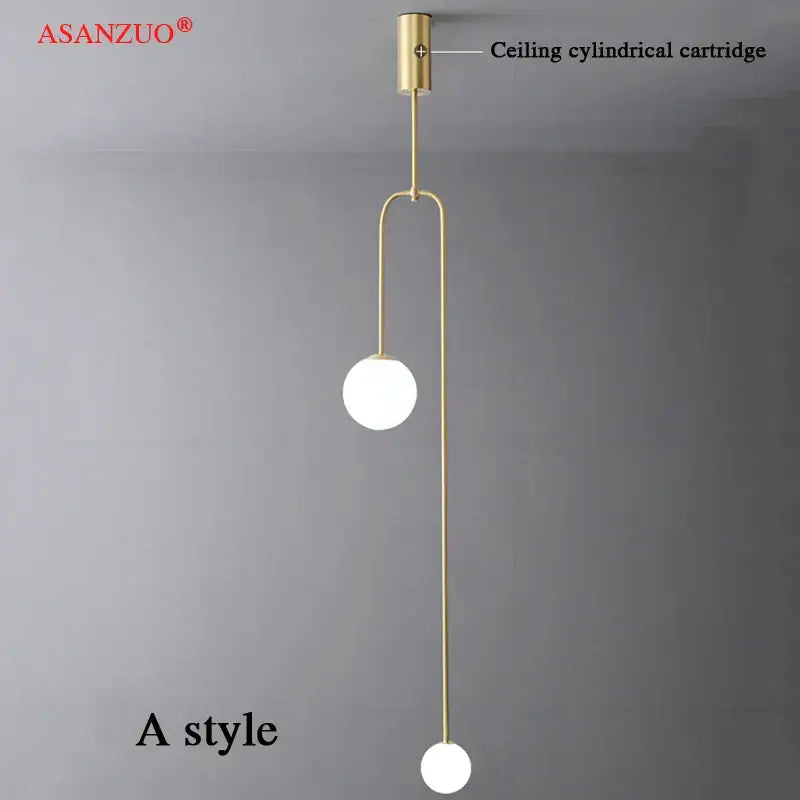 Gold-toned decorbites glass ball pendant lights with two white glass bulbs and slender metal arms for elegant lighting