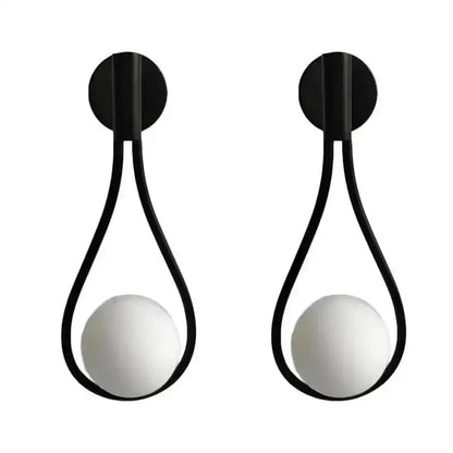 Decorbites glass ball wall lamp featuring black teardrop metal frame and white spherical glass globes for bedroom lighting