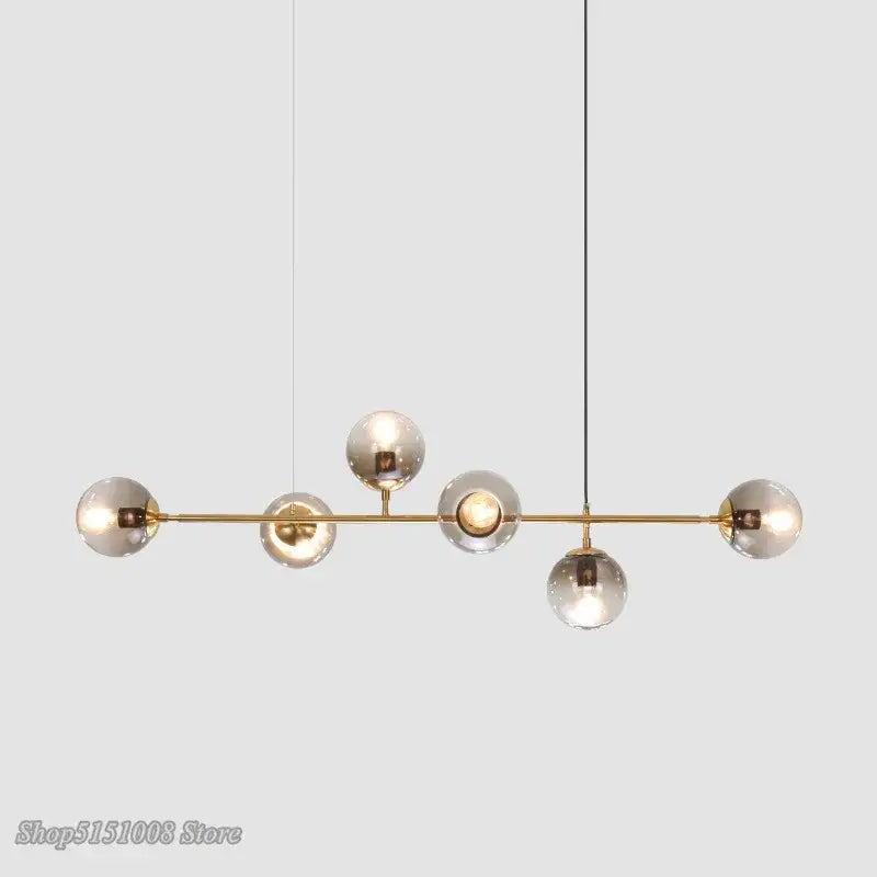 Modern brass bar pendant light with five frosted glass globe bulbs from decorbites glass ball bubble led chandelier collection