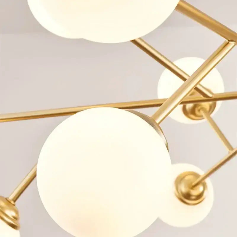 Gold-toned decorbites glass ball ceiling chandelier with frosted white spherical glass shades for bedroom lighting