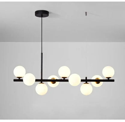Black DecorBites™ glass ball ceiling chandelier with nine frosted glass globe lights on a horizontal bar for home decor