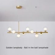 Golden DecorBites™ glass ball ceiling chandelier with spherical glass shades housing illuminated bulbs for home decor