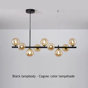 Black metal DecorBites™ ball ceiling chandelier with multiple amber-tinted glass globe shades for home lighting