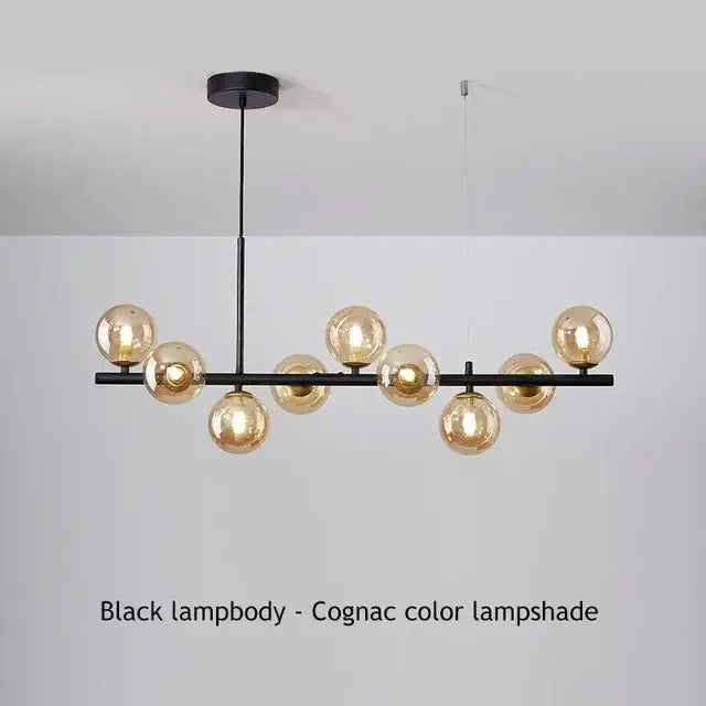 Black metal DecorBites™ ball ceiling chandelier with multiple amber-tinted glass globe shades for home lighting