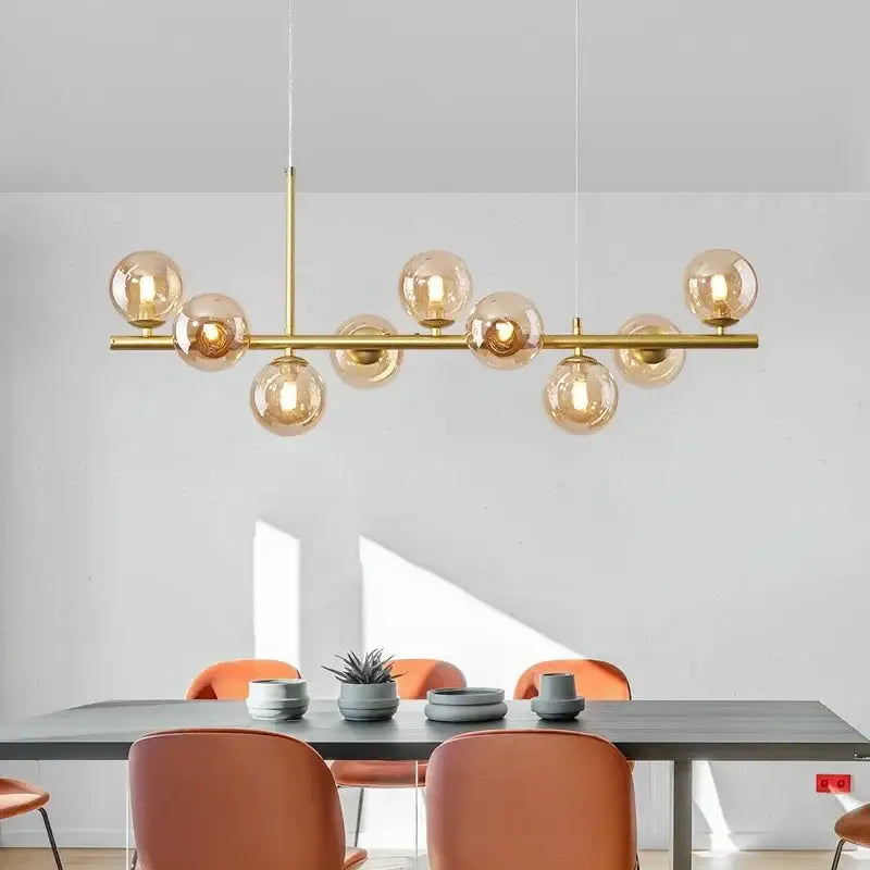 Gold-toned DecorBites™ glass ball ceiling chandelier with multiple amber glass globe bulbs on horizontal bar