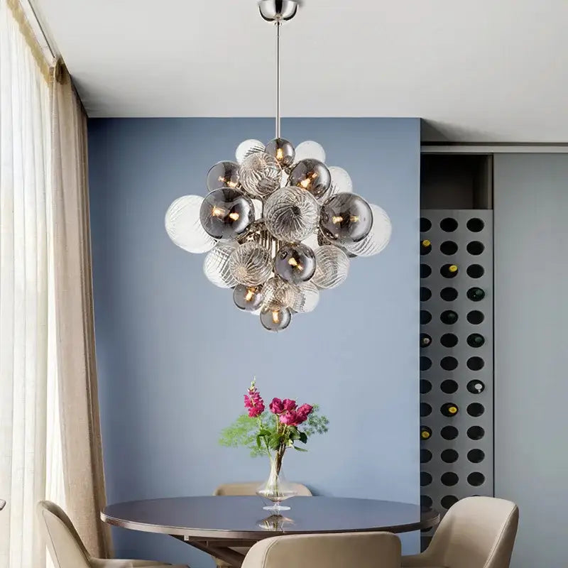 Modern decorbites glass ball ceiling chandelier with silver and clear glass spheres suspended from metallic rod