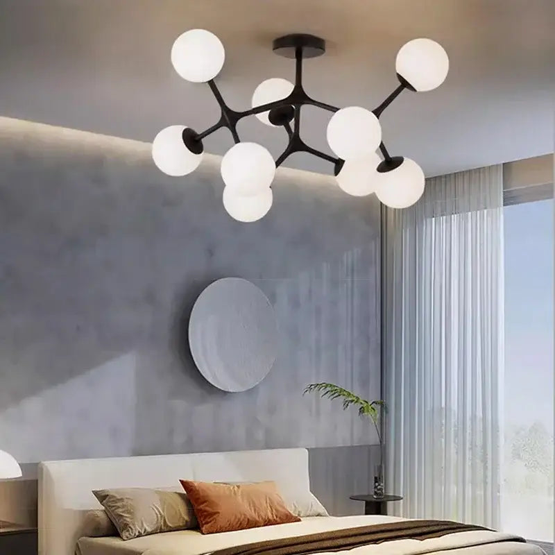 Modern black metal decorbites glass ball ceiling chandelier with multiple white spherical glass globes for living room use