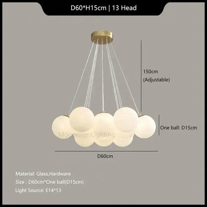 A modern decorbites glass ball pendant light with thirteen frosted glass spheres and a gold-toned ceiling mount