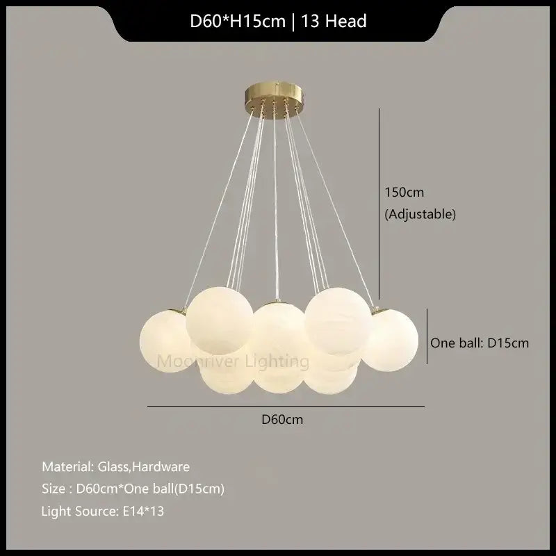 A modern decorbites glass ball pendant light with thirteen frosted glass spheres and a gold-toned ceiling mount
