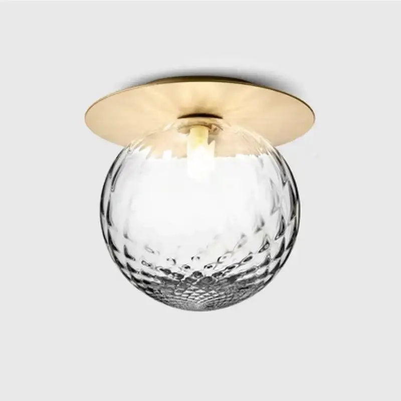 Modern decorbites glass ball ceiling lamp with textured clear glass globe and polished brass base for hallway use