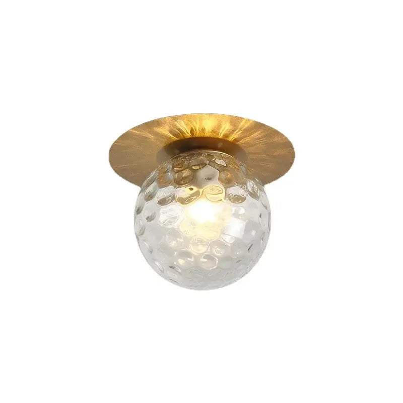 DecorBites glass ball ceiling light with clear textured glass globe and hammered gold-toned metal base for bedroom