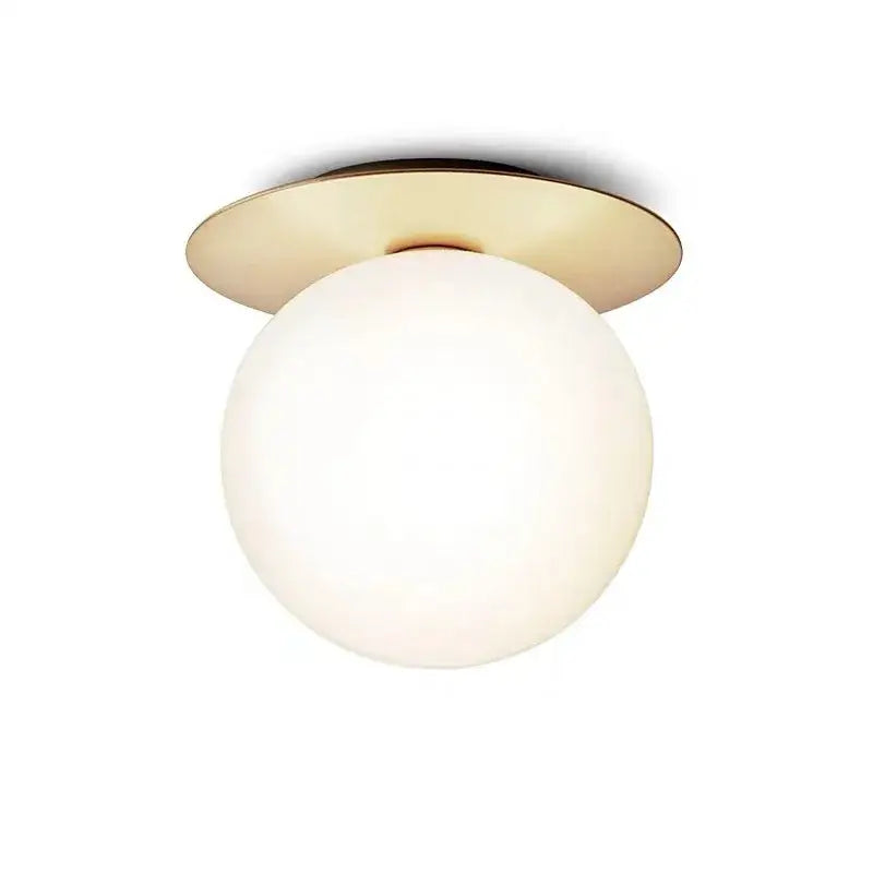A decorbites glass ball ceiling light with a matte white glass globe and polished brass base for bedroom hallway stairs
