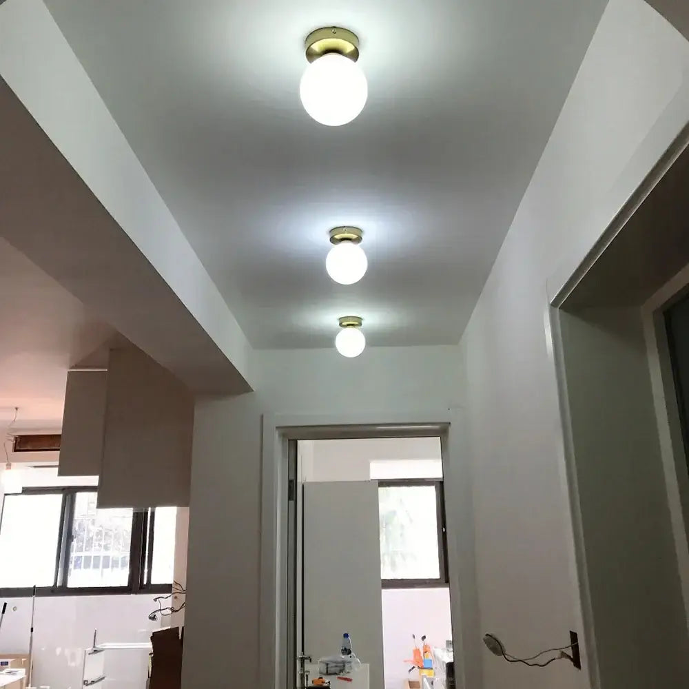 Decorbites glass ball ceiling light fixture with three frosted glass globes and brass finish for modern bedroom decor