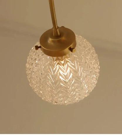 DecorBites glass ball ceiling light with clear faceted glass globe and brass-finished metal fixture for modern rooms
