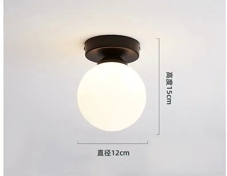A sleek decorbites glass ball ceiling light with frosted white glass globe and antique bronze metal base for modern decor