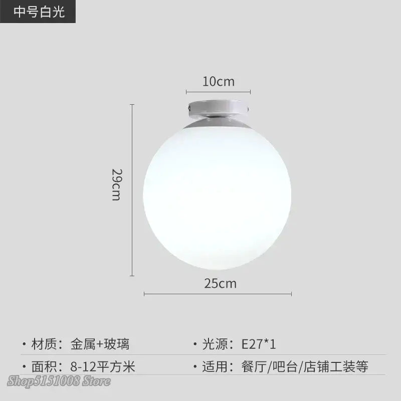 A sleek spherical white glass ball ceiling light with metallic base by DecorBites for modern kitchen decor