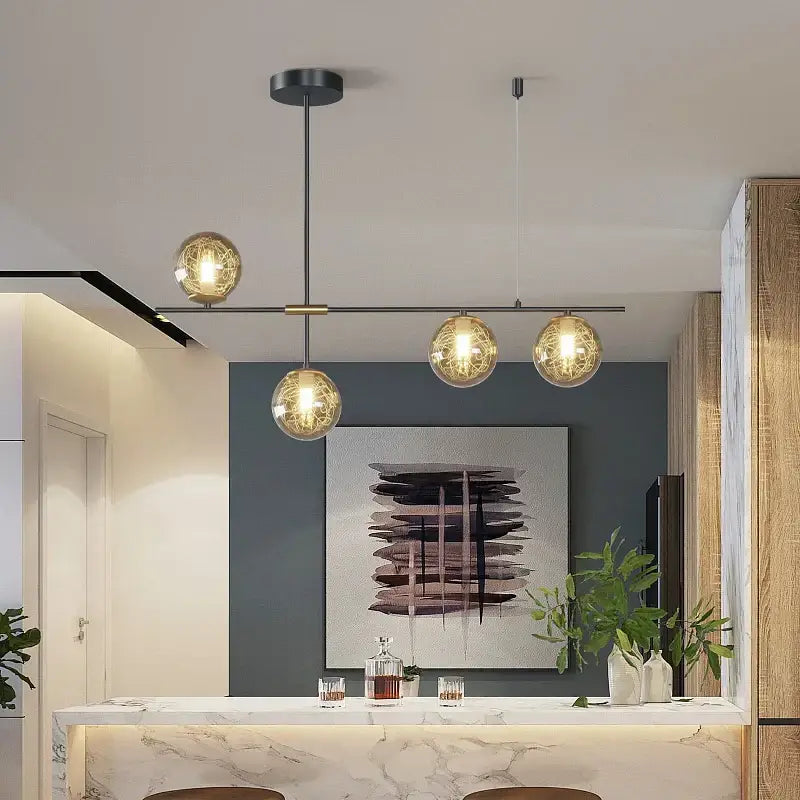 Modern decorbites glass ball chandelier with four warm golden glass bulbs and delicate wireframe for ceiling lighting